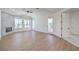 Bright bedroom featuring hardwood floors, fireplace and large windows with exterior view at 605 Canyon Greens Drive Dr, Las Vegas, NV 89144