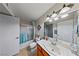 Well-lit bathroom featuring a large mirror, updated fixtures and a tub/shower combo at 698 S Racetrack Rd # 1714, Henderson, NV 89015