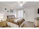 Bright bedroom featuring a decorative ceiling fan and a stylish paisley comforter at 698 S Racetrack Rd # 1714, Henderson, NV 89015