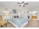 Bedroom with stylish decor, ceiling fan and adjoining bathroom access at 698 S Racetrack Rd # 1714, Henderson, NV 89015