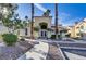 Inviting community building entrance with well-maintained grounds and mature palm trees at 698 S Racetrack Rd # 1714, Henderson, NV 89015