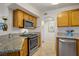 Kitchen with stainless steel appliances and attractive granite countertops at 698 S Racetrack Rd # 1714, Henderson, NV 89015