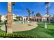 Inviting community pool surrounded by lush landscaping and palm trees on a sunny day at 698 S Racetrack Rd # 1714, Henderson, NV 89015