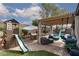 Outdoor oasis with pergola, playhouse and a swing set, perfect for Gathering fun at 7126 Mirkwood Ave, Las Vegas, NV 89178