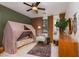 Stylish bedroom featuring unique canopy bed, modern furniture and an accent wall at 7126 Mirkwood Ave, Las Vegas, NV 89178