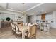 Open dining area featuring an elegant chandelier, decorative fireplace and adjacent kitchen at 7126 Mirkwood Ave, Las Vegas, NV 89178