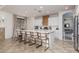 Bright, open kitchen with large island, modern appliances and seamless flow to living spaces at 7126 Mirkwood Ave, Las Vegas, NV 89178