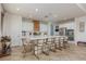 Bright kitchen with large island, marble countertops, stainless steel appliances and stylish seating at 7126 Mirkwood Ave, Las Vegas, NV 89178