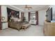 Spacious main bedroom boasts a decorative tapestry, sitting area, and neutral carpet at 7126 Mirkwood Ave, Las Vegas, NV 89178