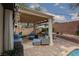 Cozy patio with pergola, swing and outdoor seating, perfect for relaxing and enjoying the backyard at 7126 Mirkwood Ave, Las Vegas, NV 89178