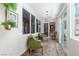 Comfortable sun room with large windows, vintage chairs, and light filtering through to the interior at 7126 Mirkwood Ave, Las Vegas, NV 89178