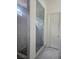 Modern bathroom featuring a glass-enclosed shower with gray tile and a tiled floor at 782 Omaggio Pl, Henderson, NV 89011