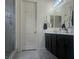 Bathroom with a glass shower, a double vanity, and tiled floors at 782 Omaggio Pl, Henderson, NV 89011
