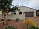 Well-maintained single-story home with desert landscaping and a two-car garage at 782 Omaggio Pl, Henderson, NV 89011