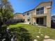 Well manicured backyard with green grass, a small balcony, and a basketball hoop at 7821 Red Leaf Dr, Las Vegas, NV 89131