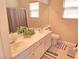 Well-lit bathroom featuring a double sink vanity and neutral color scheme at 7821 Red Leaf Dr, Las Vegas, NV 89131