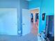 Bright bedroom with carpet floors, closet, and white doors at 7821 Red Leaf Dr, Las Vegas, NV 89131