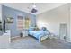 A bright bedroom with a twin bed, a fan, and a large window provides a comfortable space at 7821 Red Leaf Dr, Las Vegas, NV 89131
