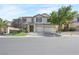 Beautiful two-story home with well-manicured lawn and three-car garage at 7821 Red Leaf Dr, Las Vegas, NV 89131
