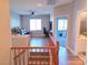 Upstairs hallway with wood floors leading to living room and bathroom at 7821 Red Leaf Dr, Las Vegas, NV 89131