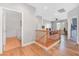 Bright hallway with wood floors leading to living area and laundry room at 7821 Red Leaf Dr, Las Vegas, NV 89131