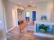 Upstairs hallway with wood floors and built-in shelving at 7821 Red Leaf Dr, Las Vegas, NV 89131