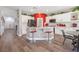 Spacious kitchen featuring white cabinets, a center island with seating, and modern appliances at 7821 Red Leaf Dr, Las Vegas, NV 89131