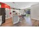 Bright kitchen with white cabinets, a center island, and adjacent dining area with access to the backyard at 7821 Red Leaf Dr, Las Vegas, NV 89131