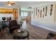 Living room with modern masks displayed on the wall, decorations, and stairs at 7821 Red Leaf Dr, Las Vegas, NV 89131