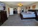 Spacious main bedroom featuring carpet floors, a large bed, and tv at 7821 Red Leaf Dr, Las Vegas, NV 89131