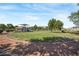 Community park with a grassy field and playground area on a sunny day at 7821 Red Leaf Dr, Las Vegas, NV 89131