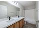 Bathroom featuring double sinks, white counters, and shower-tub combo at 7836 Pinnochio Ave, Las Vegas, NV 89131