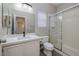 Bathroom featuring granite countertops, walk-in shower with glass doors at 7836 Pinnochio Ave, Las Vegas, NV 89131