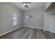 Bedroom features new vinyl floors, double windows, and closet at 7836 Pinnochio Ave, Las Vegas, NV 89131