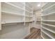 Spacious walk-in closet with ample shelving and hanging space for organization at 7836 Pinnochio Ave, Las Vegas, NV 89131