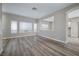 Spacious living room featuring new floors, neutral walls, and an archway to the kitchen at 7836 Pinnochio Ave, Las Vegas, NV 89131