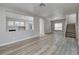Open-concept living area featuring new floors, neutral paint, and lots of natural light at 7836 Pinnochio Ave, Las Vegas, NV 89131