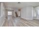 Bright living room with staircase and entry door providing access and light at 7836 Pinnochio Ave, Las Vegas, NV 89131