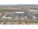 Expansive aerial view of the commercial area with ample parking and many businesses and residential area nearby at 8055 Tank Loop St, Las Vegas, NV 89166