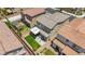 Aerial view of a home featuring a pristine artificial lawn, concrete patio, and outdoor pergola at 8055 Tank Loop St, Las Vegas, NV 89166