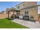 Cozy backyard featuring a pergola, grill, and manicured lawn perfect for outdoor entertaining at 8055 Tank Loop St, Las Vegas, NV 89166
