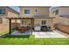 Landscaped backyard features artificial turf, a pergola, patio and barbeque area, perfect for entertaining at 8055 Tank Loop St, Las Vegas, NV 89166