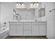 Modern bathroom featuring a double sink vanity and a large mirror, providing a clean and functional space at 8055 Tank Loop St, Las Vegas, NV 89166