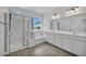 Bright bathroom featuring dual sinks, a separate shower, and a bathtub, offering both convenience and relaxation at 8055 Tank Loop St, Las Vegas, NV 89166