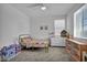 Bright bedroom with natural light featuring a bed, dresser, and play area, perfect for a retreat at 8055 Tank Loop St, Las Vegas, NV 89166