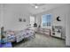 Cozy bedroom featuring a twin bed, a dresser, and a large window, creating a comfortable and inviting atmosphere at 8055 Tank Loop St, Las Vegas, NV 89166