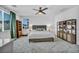 Spacious bedroom with neutral walls, carpet, ceiling fan, and natural light at 8055 Tank Loop St, Las Vegas, NV 89166