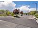 Aspen gated community entrance features lush landscaping and decorative brick-paved roads at 8055 Tank Loop St, Las Vegas, NV 89166