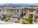 Beautiful two-story home with well-manicured landscaping, a two-car garage, and charming architectural details at 8055 Tank Loop St, Las Vegas, NV 89166