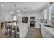 Bright kitchen features white cabinets, stainless steel appliances, and a large center island with bar seating at 8055 Tank Loop St, Las Vegas, NV 89166